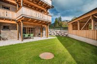 Vonkajšia záhrada v ubytovaní Dachstein West Apartments