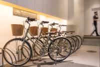 a row of bikes parked in a row in a museum at Just Enjoy Business Hotel in Tainan