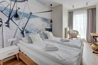 Posteľ alebo postele v izbe v ubytovaní Wave Apartments - Powstańców Wielkopolskich
