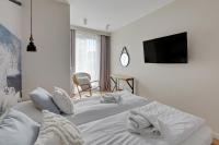 Posteľ alebo postele v izbe v ubytovaní Wave Apartments - Powstańców Wielkopolskich