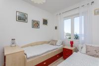 Posteľ alebo postele v izbe v ubytovaní Apartment Lusi