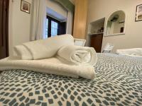 Posteľ alebo postele v izbe v ubytovaní "The Gole of Alcantara Living in the Dream's Room"