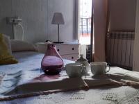 Postel nebo postele na pokoji v ubytování Hostal Romero