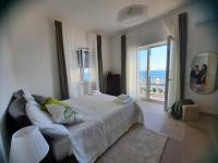 A bed or beds in a room at BELLAVISTA CASA SUL MARE