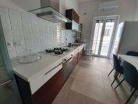 A kitchen or kitchenette at BELLAVISTA CASA SUL MARE