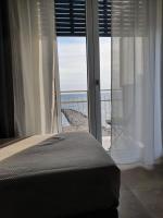 A bed or beds in a room at BELLAVISTA CASA SUL MARE