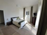 A bed or beds in a room at BELLAVISTA CASA SUL MARE