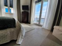A bed or beds in a room at BELLAVISTA CASA SUL MARE