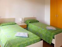 A bed or beds in a room at Apartment Riviera 3 by Interhome