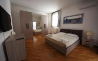 A bed or beds in a room at VILLA AZZURRA beachfront Mondello - Palermo