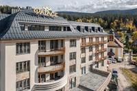an apartment building with a pizza sign on the roof at Palace Apartments in Špindlerův Mlýn