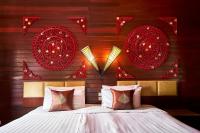 Postel nebo postele na pokoji v ubytování Ruenkanok Thaihouse Resort