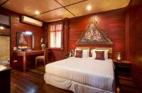 Postel nebo postele na pokoji v ubytování Ruenkanok Thaihouse Resort