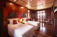 Postel nebo postele na pokoji v ubytování Ruenkanok Thaihouse Resort