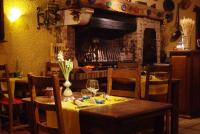 a dining room with a table with a yellow table cloth at Hotel de Bourgogne in Saulieu