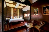 Postel nebo postele na pokoji v ubytování Ruenkanok Thaihouse Resort