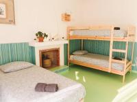Postel nebo postele na pokoji v ubytování Hospedium Hostel República Surf House
