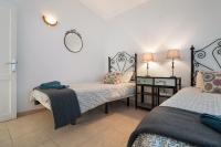 A bed or beds in a room at Apt 2 Las Palmeras iii Lanzarote