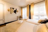 Posteľ alebo postele v izbe v ubytovaní LA CONCHA BEACHVIEW by SWEET HOME SAN SEBASTIAN