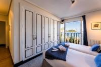 Posteľ alebo postele v izbe v ubytovaní LA CONCHA BEACHVIEW by SWEET HOME SAN SEBASTIAN