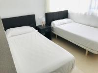 Posteľ alebo postele v izbe v ubytovaní Portofino Mar