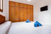 Postel nebo postele na pokoji v ubytování Las Casitas 28