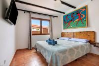 Postel nebo postele na pokoji v ubytování Las Casitas 28