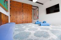 Postel nebo postele na pokoji v ubytování Las Casitas 28