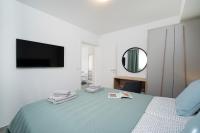 Postel nebo postele na pokoji v ubytování Apartments Palma Rabac