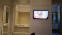 Televízia a/alebo spoločenská miestnosť v ubytovaní Guest House Piazza Bologna