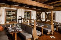 a dining room with a table and chairs at Caravan Park Sexten in Sesto