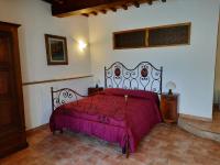 A bed or beds in a room at SassoMatto b&b BioAgrituRelax
