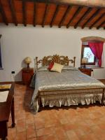 A bed or beds in a room at SassoMatto b&b BioAgrituRelax
