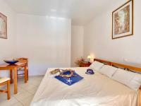 A bed or beds in a room at SeaFront Villa Ourania