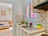 A kitchen or kitchenette at SeaFront Villa Ourania