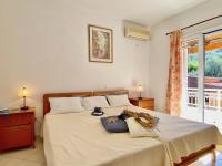 A bed or beds in a room at SeaFront Villa Ourania