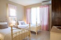 Postel nebo postele na pokoji v ubytování Ionian Luxury Villas