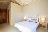 Postel nebo postele na pokoji v ubytování Ionian Luxury Villas
