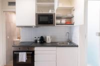 Kuchyňa alebo kuchynka v ubytovaní Vibe Apartments by Olala Homes