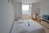 Posteľ alebo postele v izbe v ubytovaní Apartments Tamarix