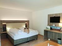 Postel nebo postele na pokoji v ubytování Hotel Landhaus Höpen