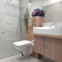 Kúpeľňa v ubytovaní Q Apart AMBER - klimatyzowane STUDIO przy Manufakturze z garażem Gratis, FV