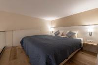 Posteľ alebo postele v izbe v ubytovaní Ozone One Apartment