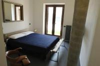 Posteľ alebo postele v izbe v ubytovaní San Venanzo - Casale de Conti