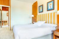 Postel nebo postele na pokoji v ubytování Hotel Vejo