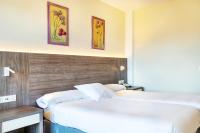 Postel nebo postele na pokoji v ubytování Hotel Vejo