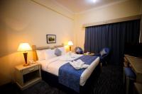 Green House Hotel Suites & Apartmentにあるベッド