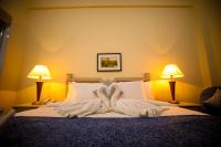 Green House Hotel Suites & Apartmentにあるベッド