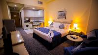 Green House Hotel Suites & Apartmentにあるベッド