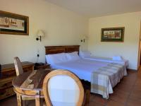 Postel nebo postele na pokoji v ubytování La Figuerola Hotel & Restaurant